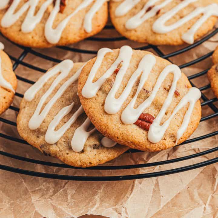 Spice drop cookies with a glaze cooling on a cooling rack.