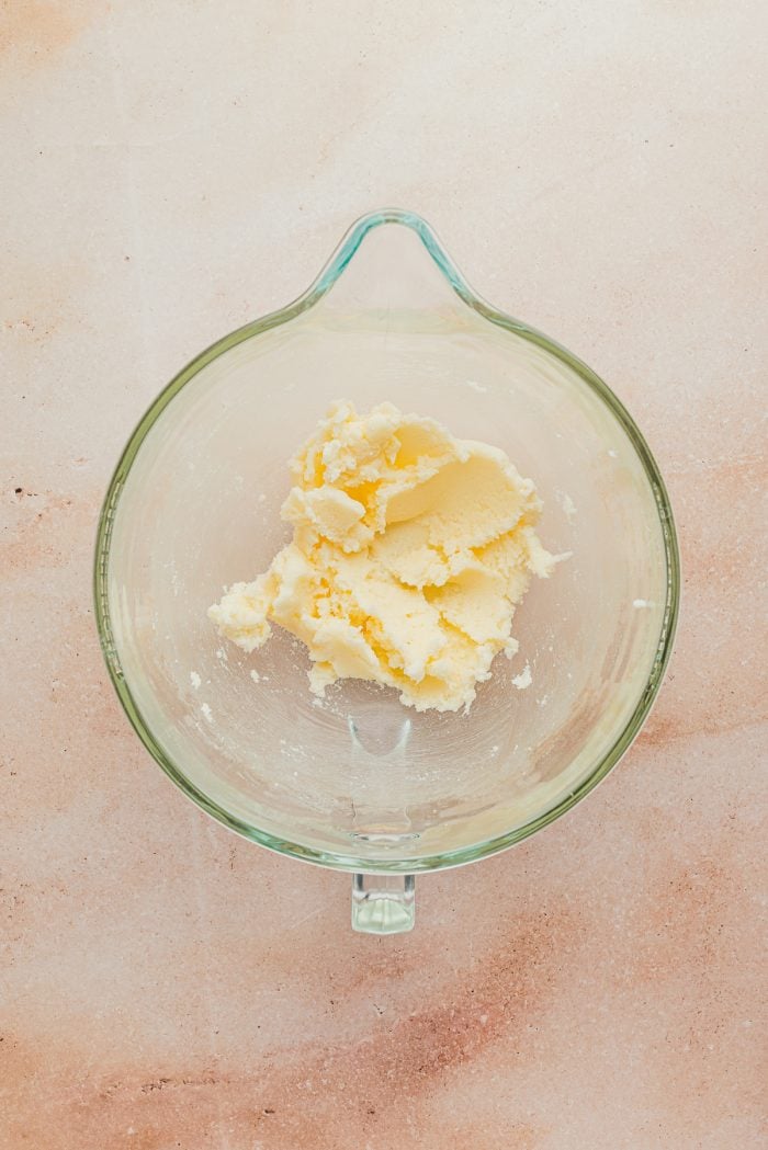 Butter added to a glass bowl.