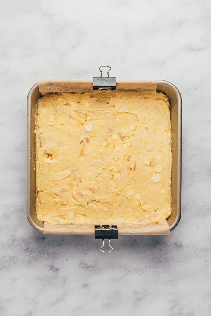 A baking tray with unbaked lemon Blondie batter.