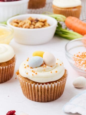 A decorated carrot cake cupcake.