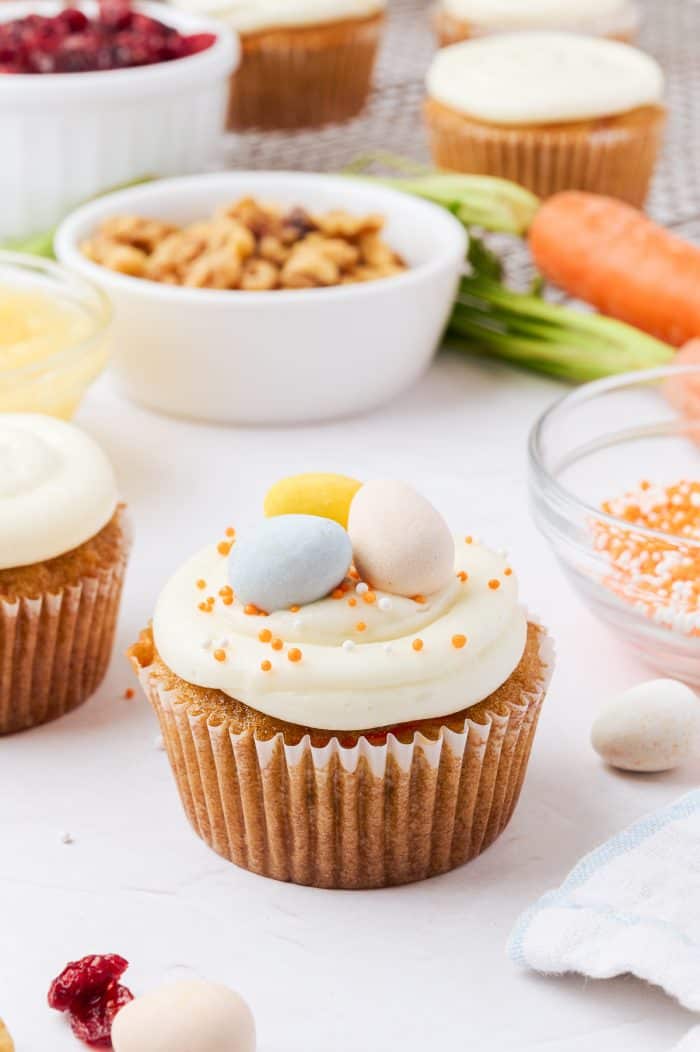 A decorated carrot cake cupcake.