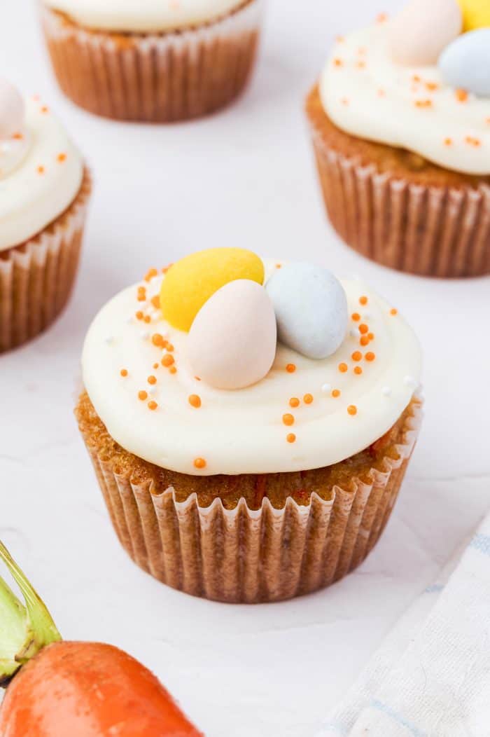 Decorated carrot cake cupcakes.