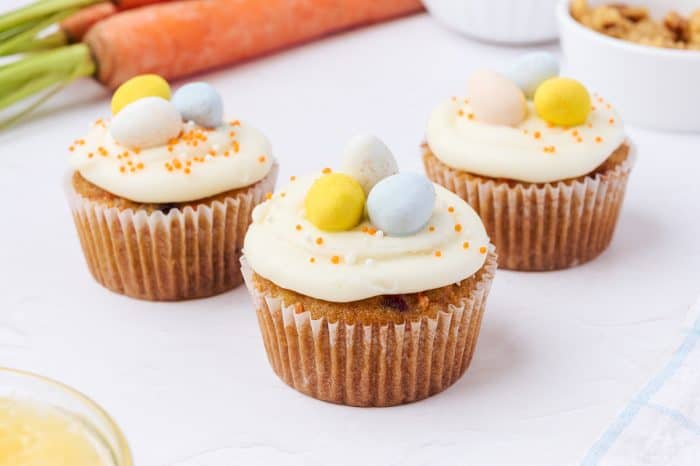 Decorated carrot cake cupcakes.