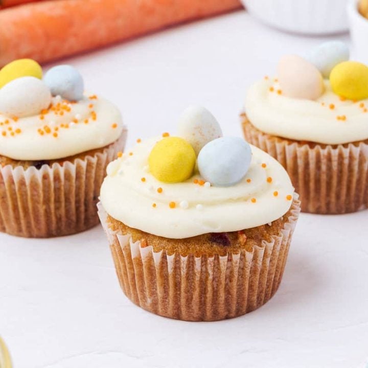 Decorated carrot cake cupcakes.