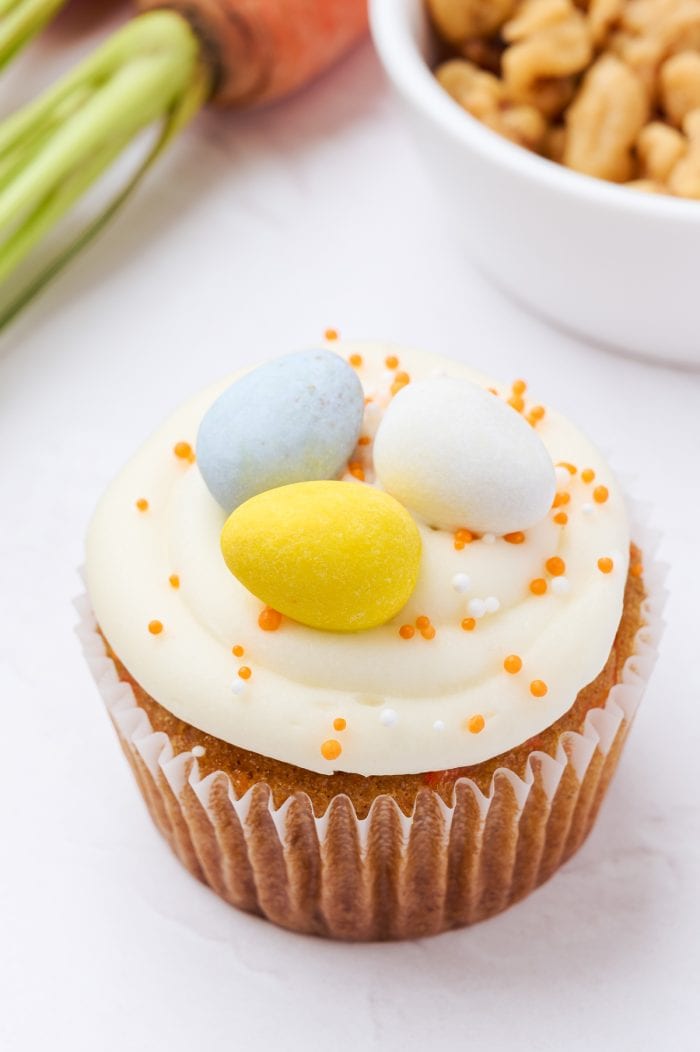 A decorated carrot cake cupcake.