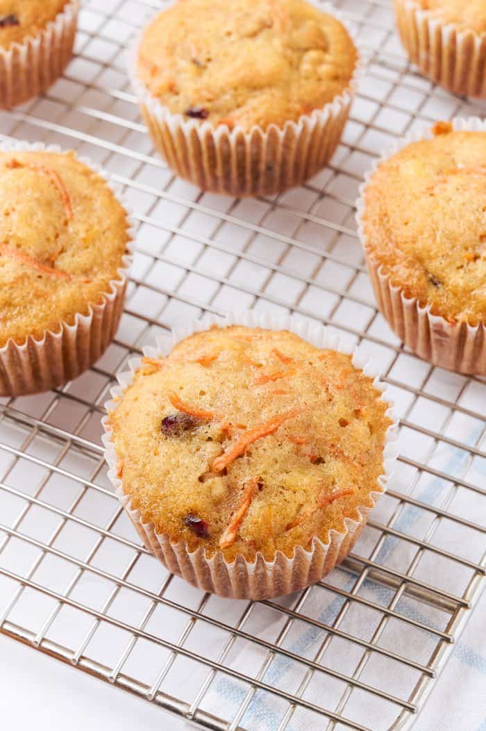 Baked carrot cake cupcakes on a cooling rake.