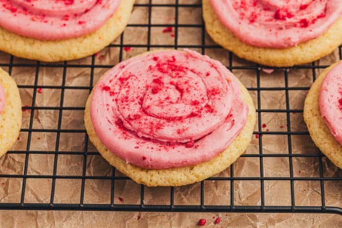 Lemon sugar cookies with raspberry cream cheese frosting.