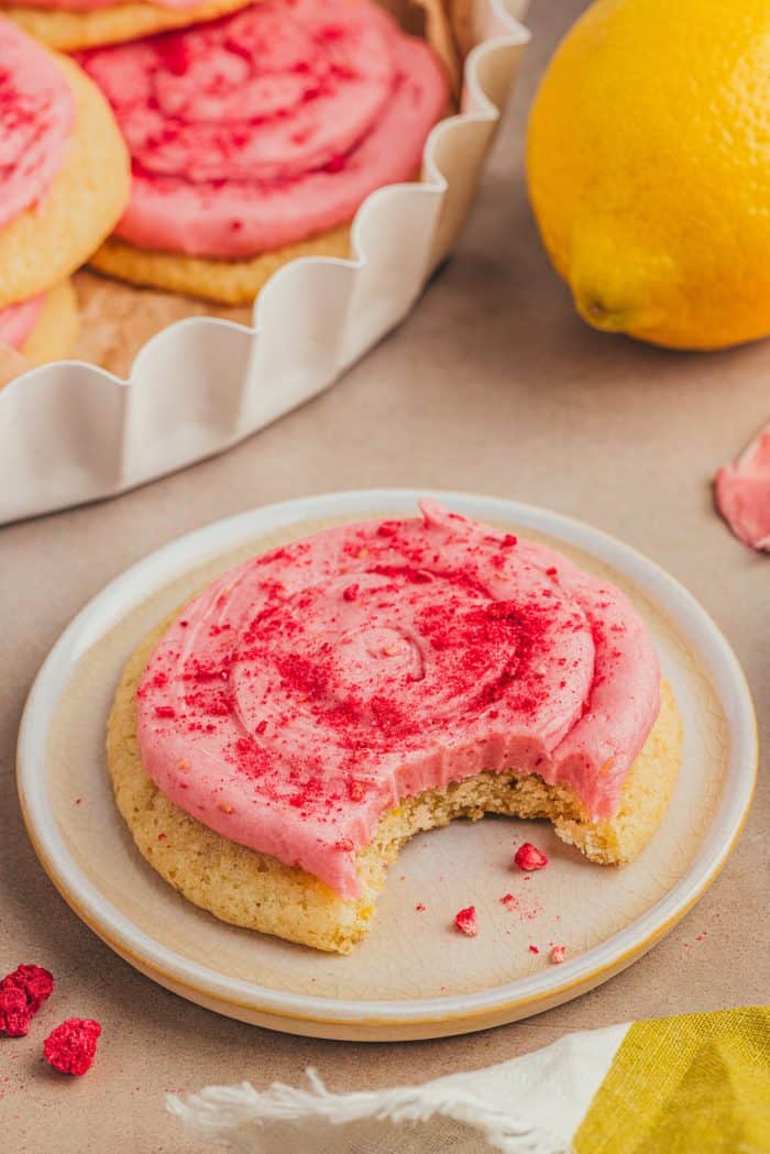 A lemon sugar cookie on a white plate.