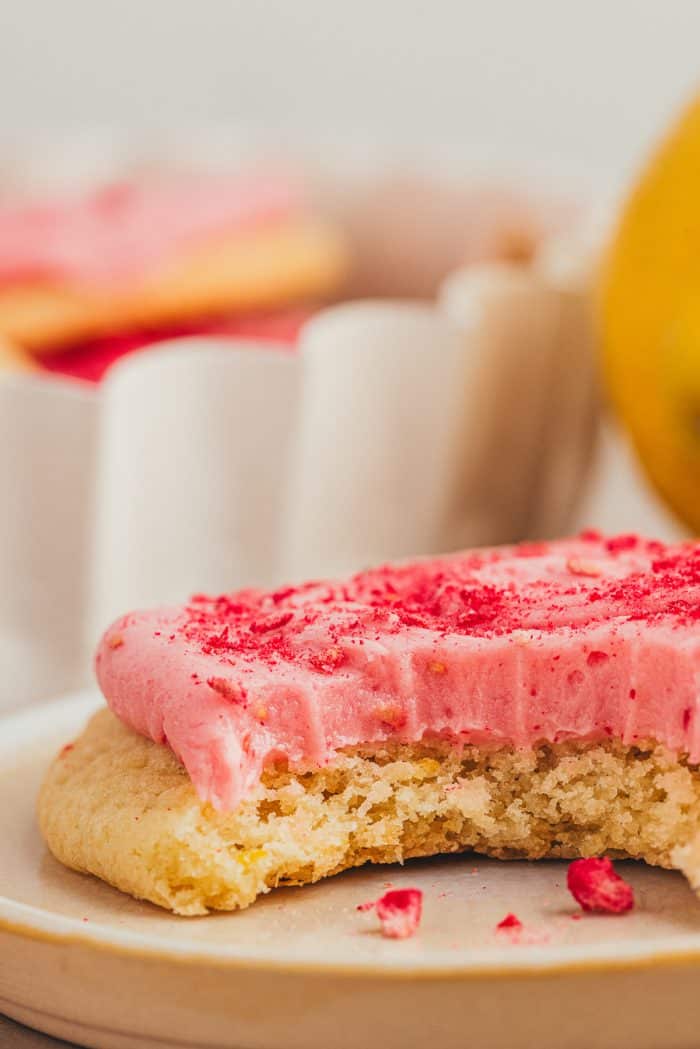 A lemon sugar cookie on a white plate.