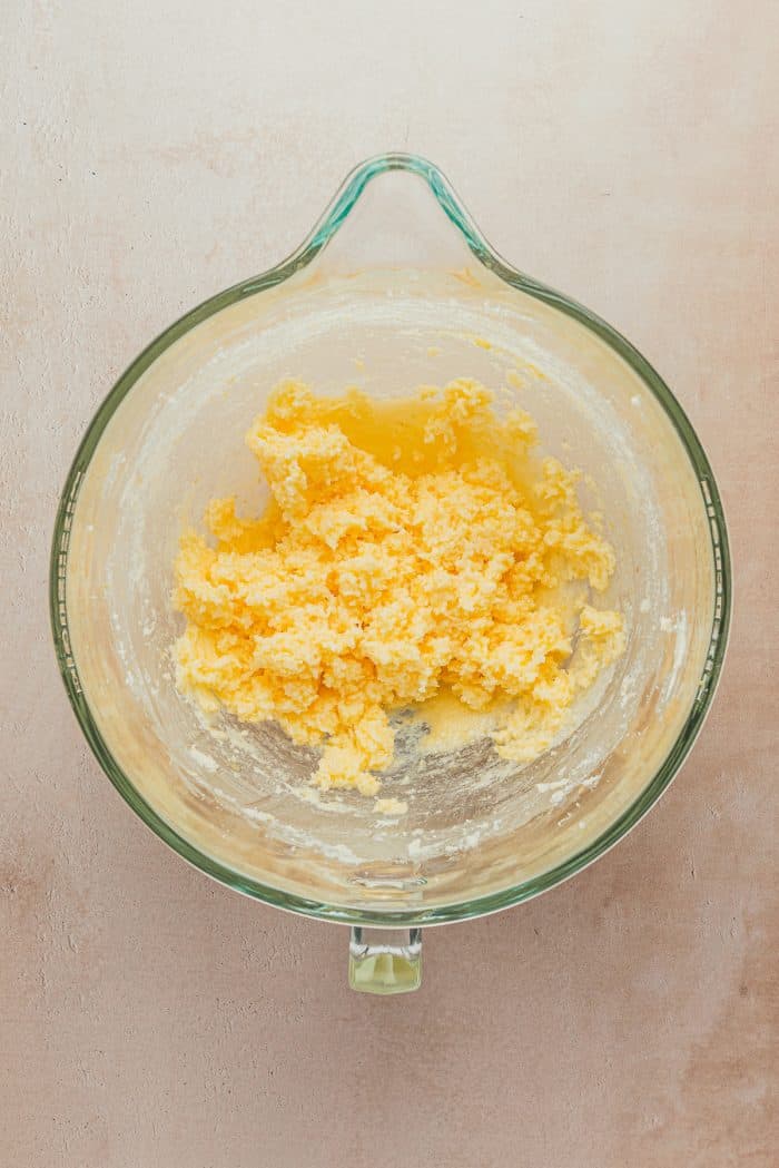 A glass bowl containing lemon sugar cookie batter.