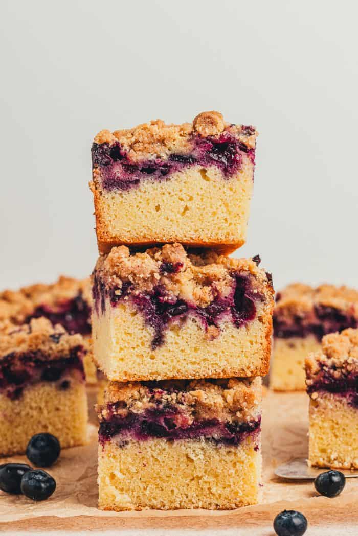 A stack of blueberry crumb cake slices.