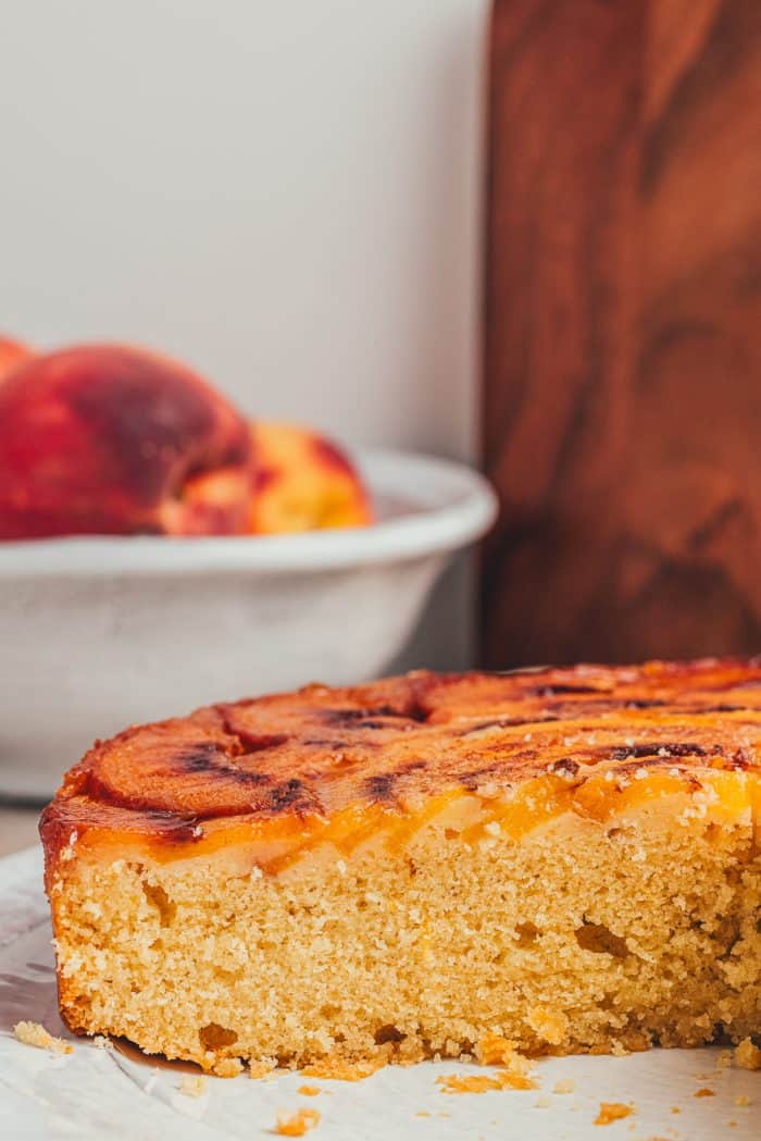 An image of upside-down cake that is cut in half.