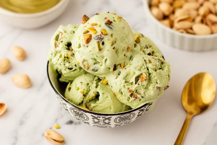 A bowl with many scoops of no churn Pistachio Ice cream.