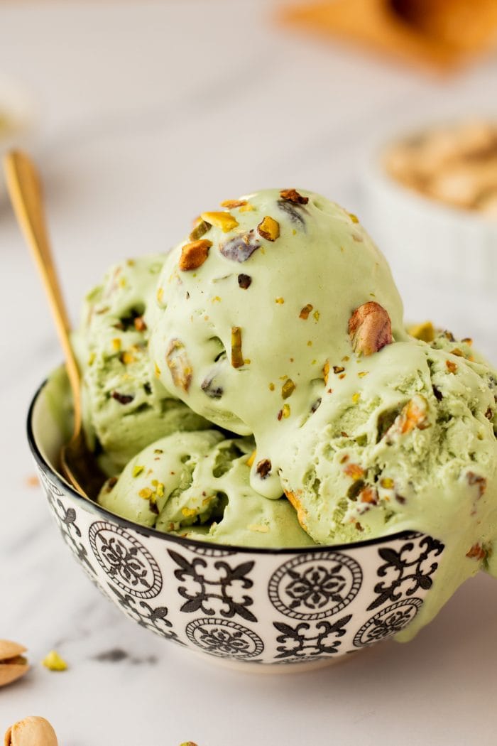 A bowl with many scoops of no churn Pistachio Ice cream.