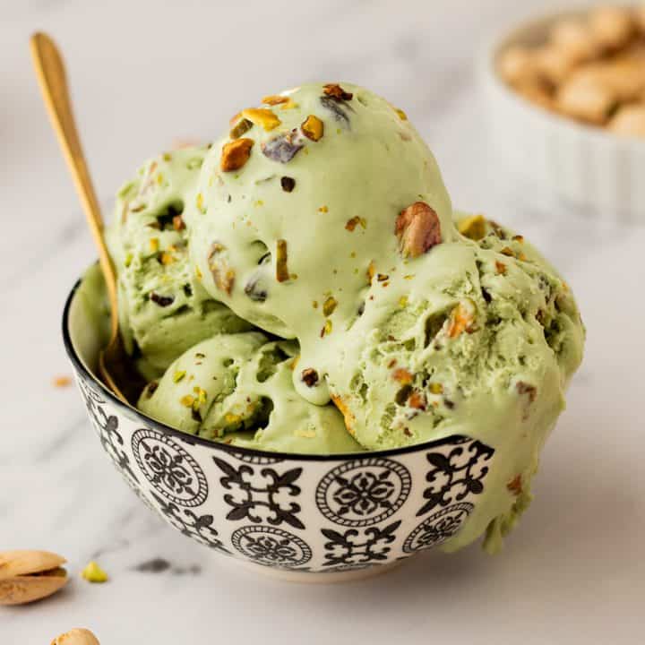A bowl with many scoops of no churn Pistachio Ice cream.