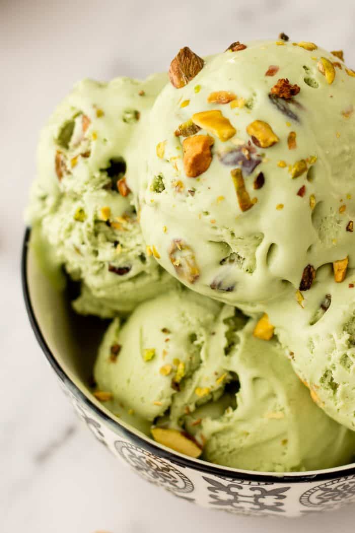 A bowl with many scoops of no churn Pistachio Ice cream.