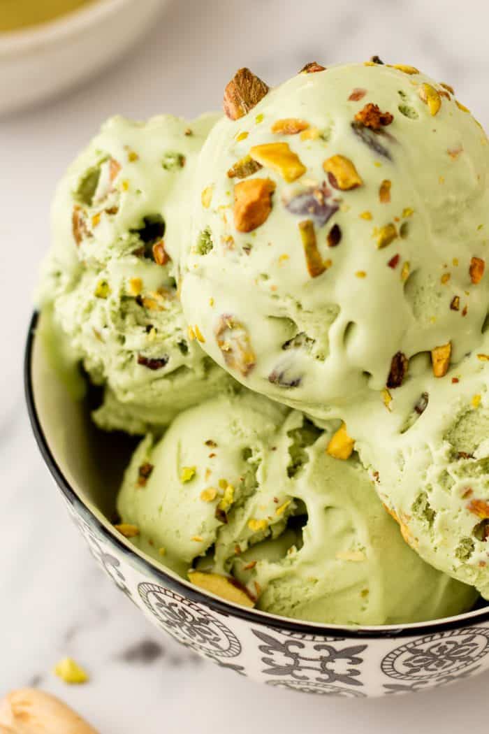 A bowl with many scoops of no churn Pistachio Ice cream.