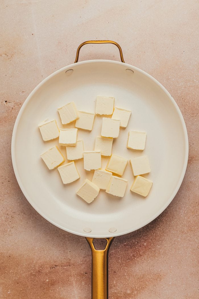 Cubed butter added to the skillet.