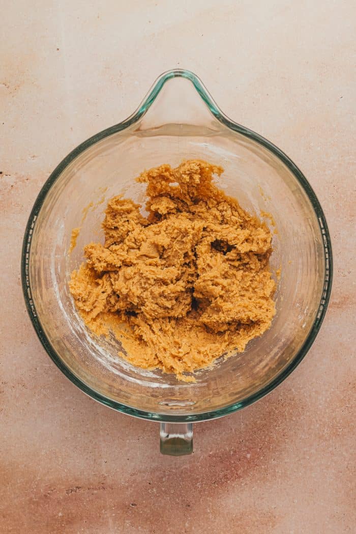 The flour mixture added to the glass mixing bowl.