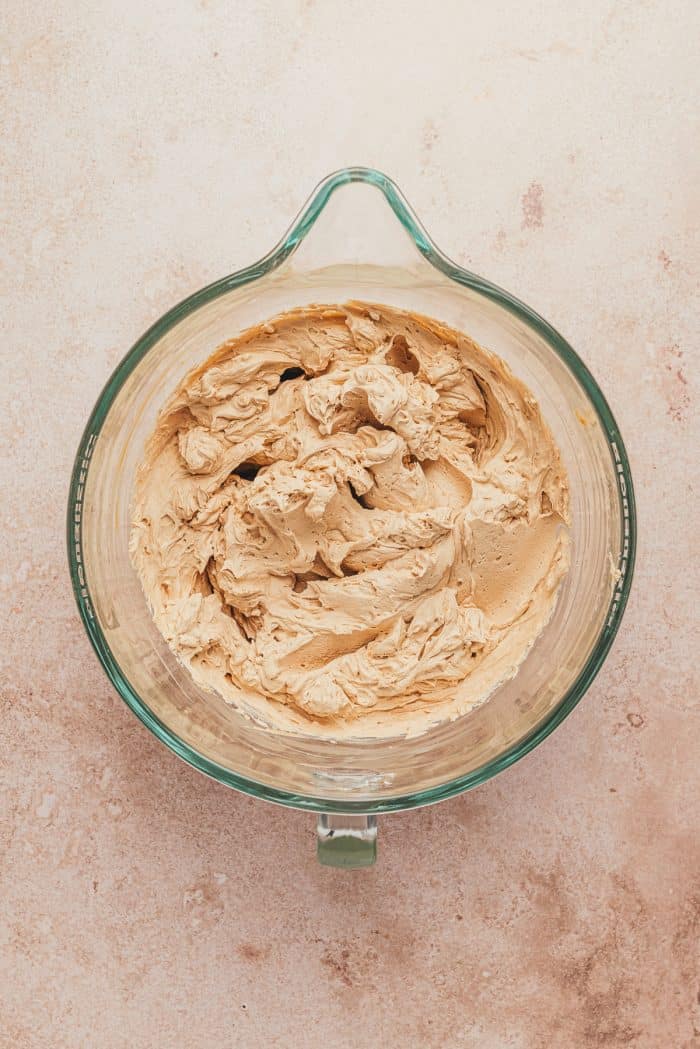 A bowl of mascapone cream mixed with espesso in a glass dish.