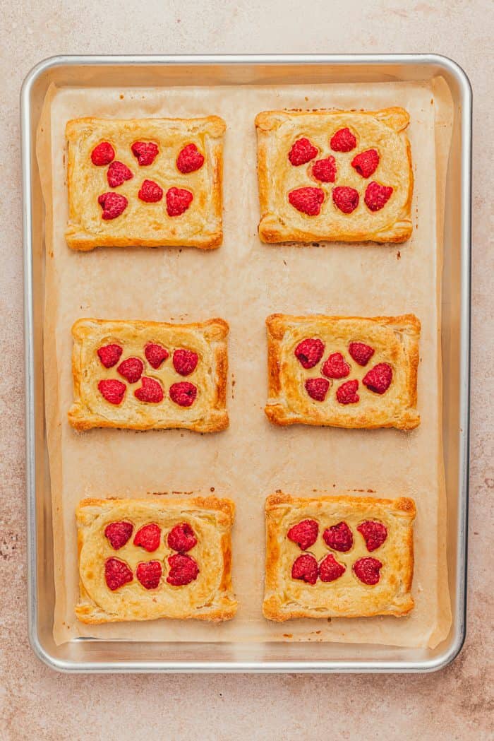 Freshly baked raspberry cream cheese danishes.