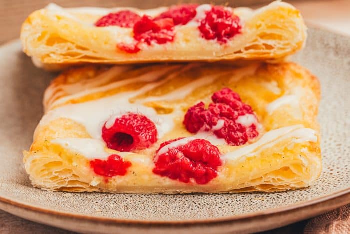 Two homemade danishes on a plate.
