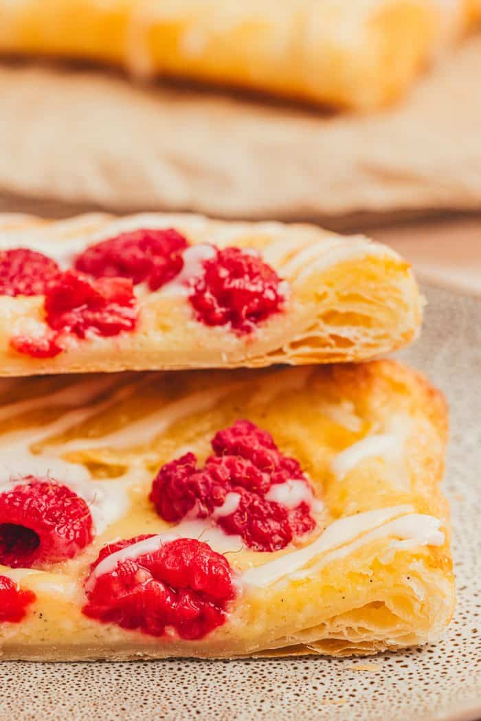 Two homemade danishes on a plate.