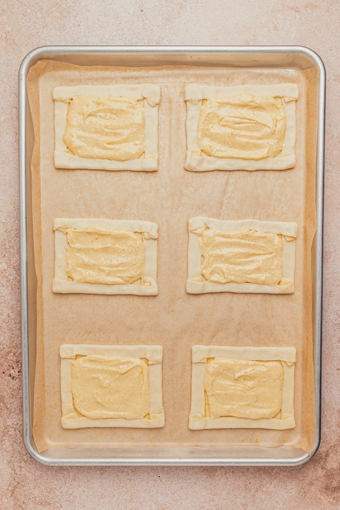 Raw puff pastry filled with cream cheese danish filling.