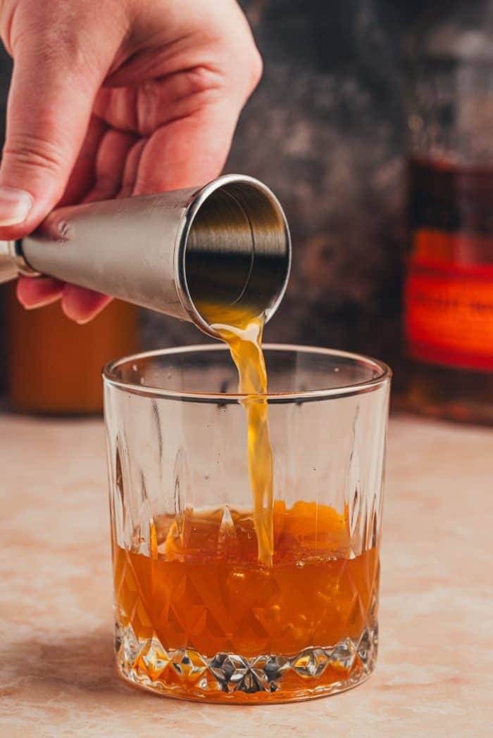 Alcohol being poured into a glass.