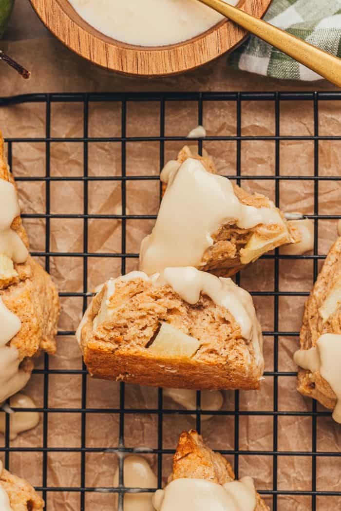 Apple cinnamon scones on a wire rack.