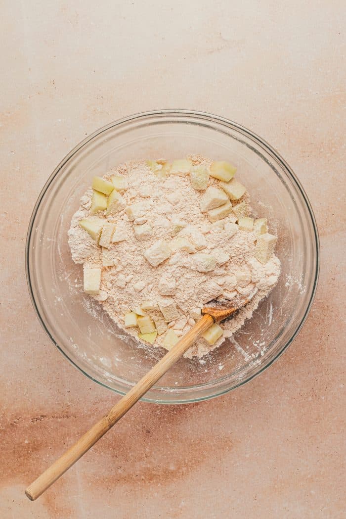 Diced apples added to the flour mixture.
