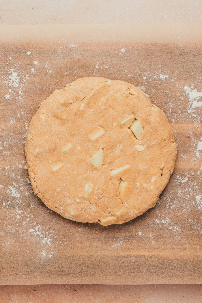 The scone dough formed into a circle.