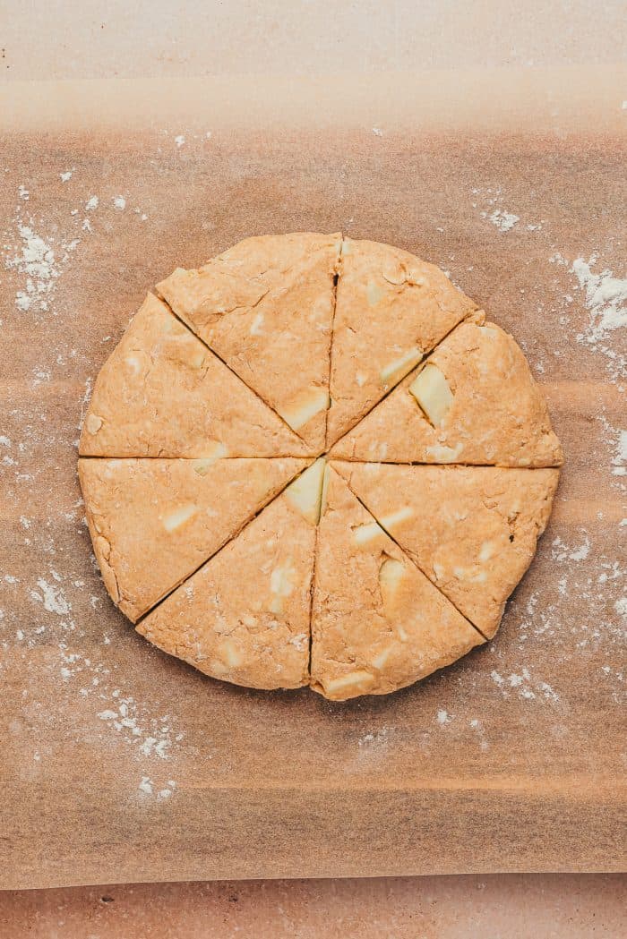 The disc of scone dough cut into 8 pieces.