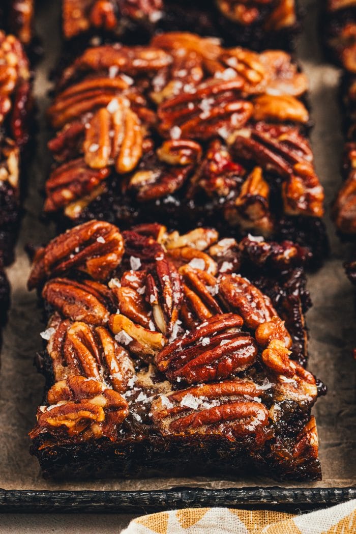 The sliced pecan pie brownies on a tray.
