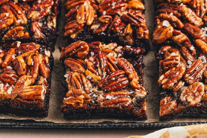 The sliced pecan pie brownies on a tray.