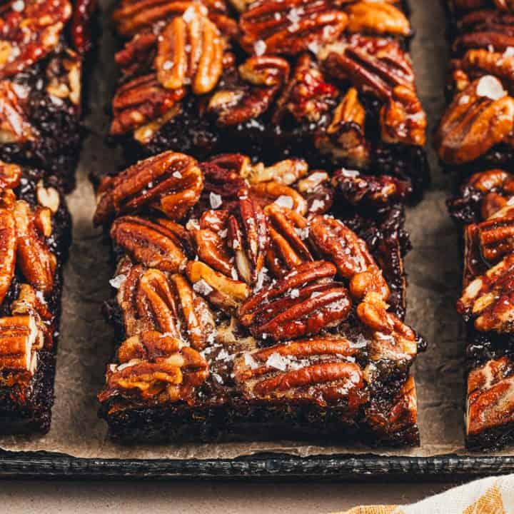 The sliced pecan pie brownies on a tray.