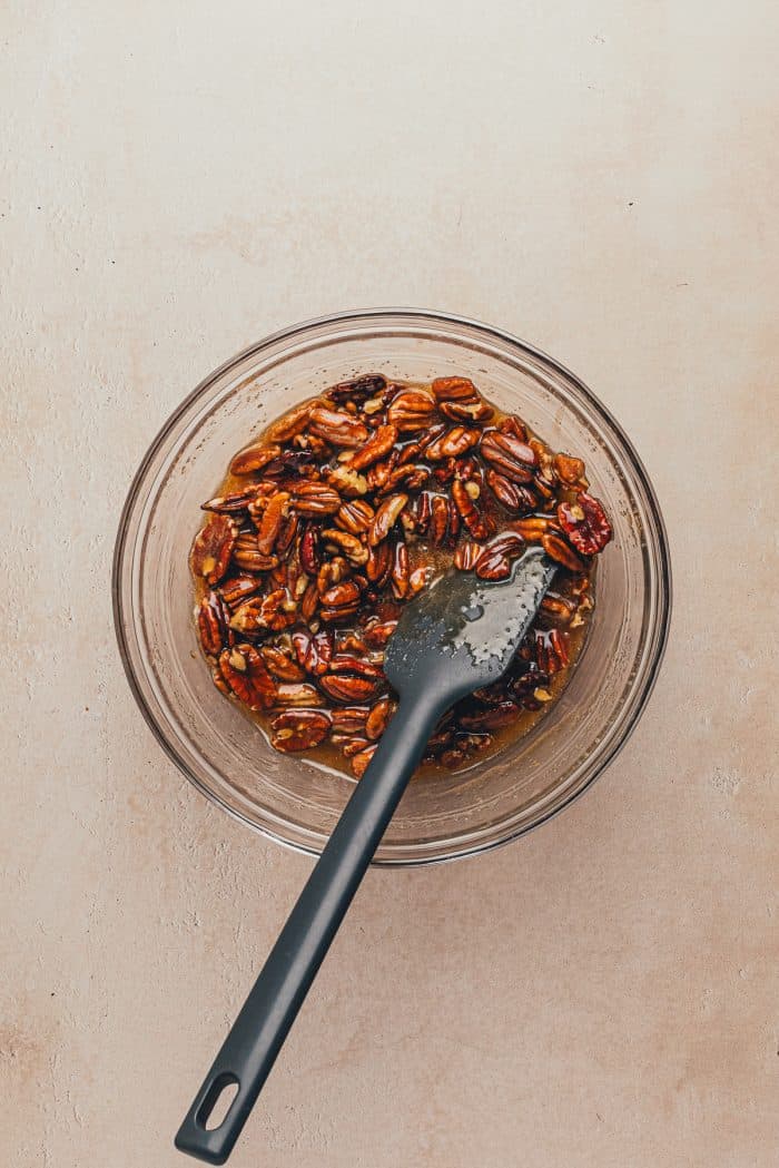The pecan mixture in a glass bowl.