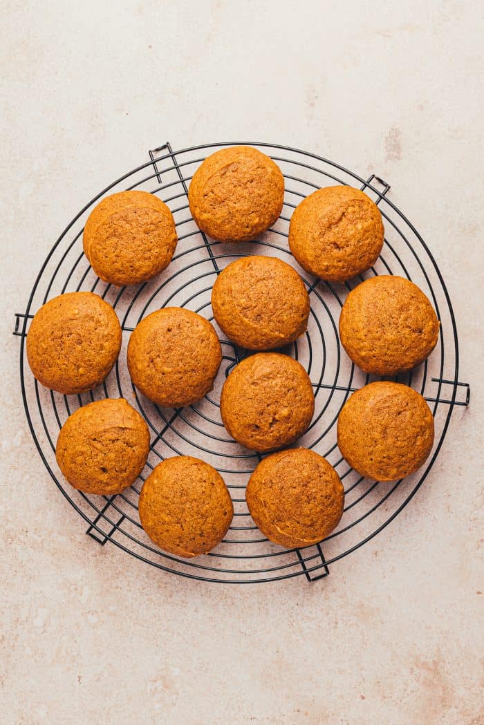 Pumpkin whoopie pies on a cooling rack. 