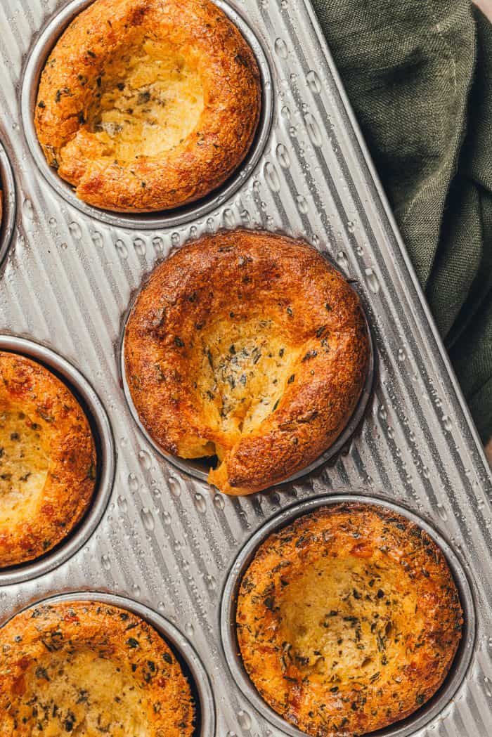 Herbed popovers in a baking tray.