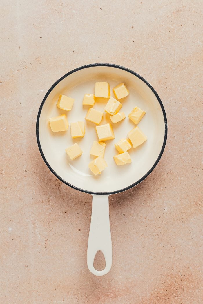 Cubed butter in a saucepan.
