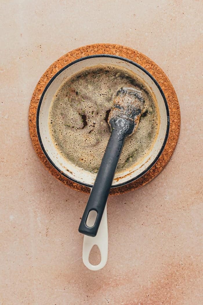 A saucepan with brown butter.