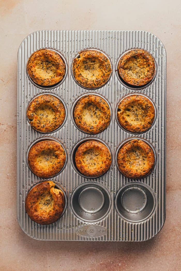 The baked rosemary popovers in a cupcake tray.