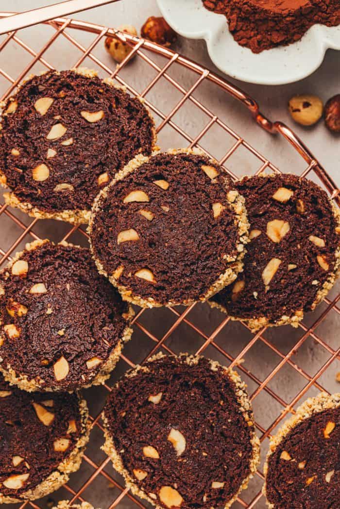 Chocolate hazelnut shortbread cookies on a cooling rack.
