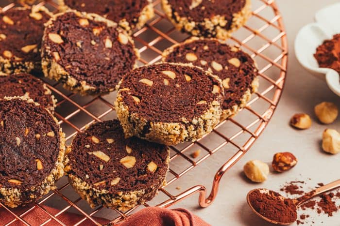 Chocolate hazelnut shortbread cookies on a cooling rack.
