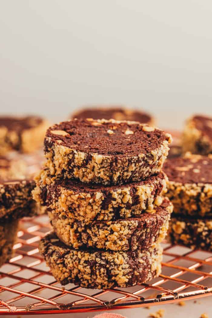 Chocolate hazelnut slice and bake cookies on a cooling rack.