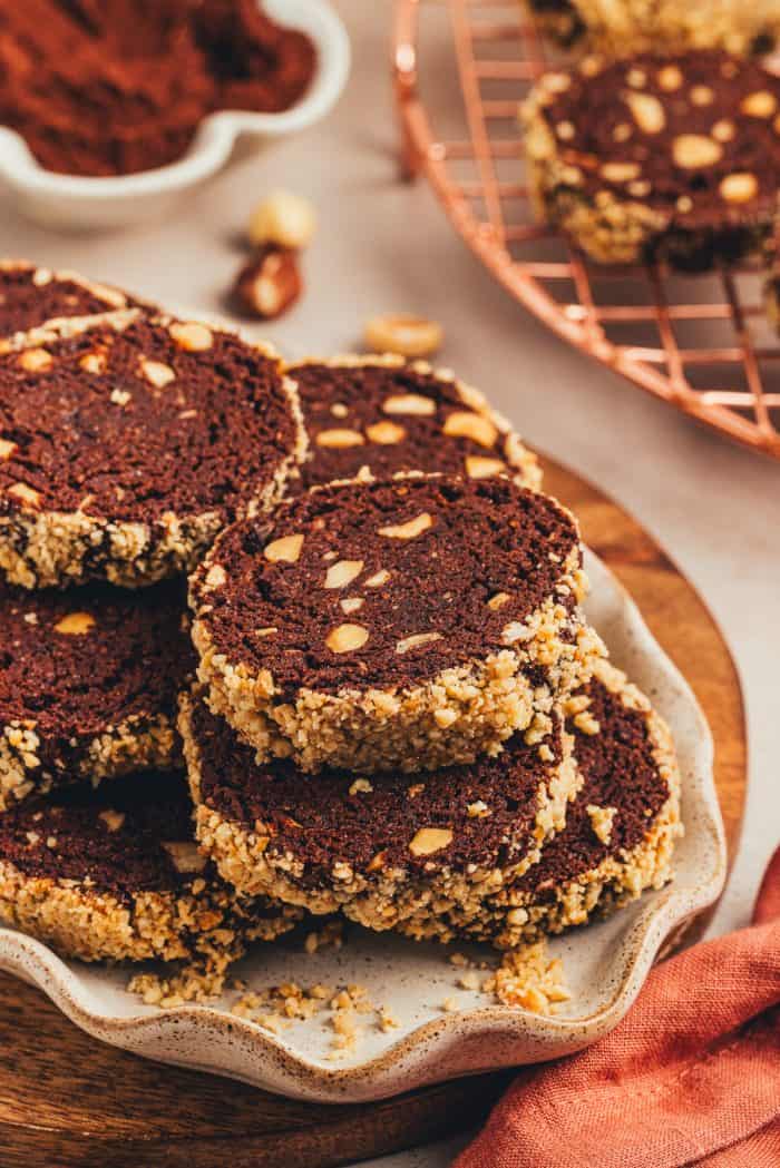 A plate with chocolate slice and bake cookies.