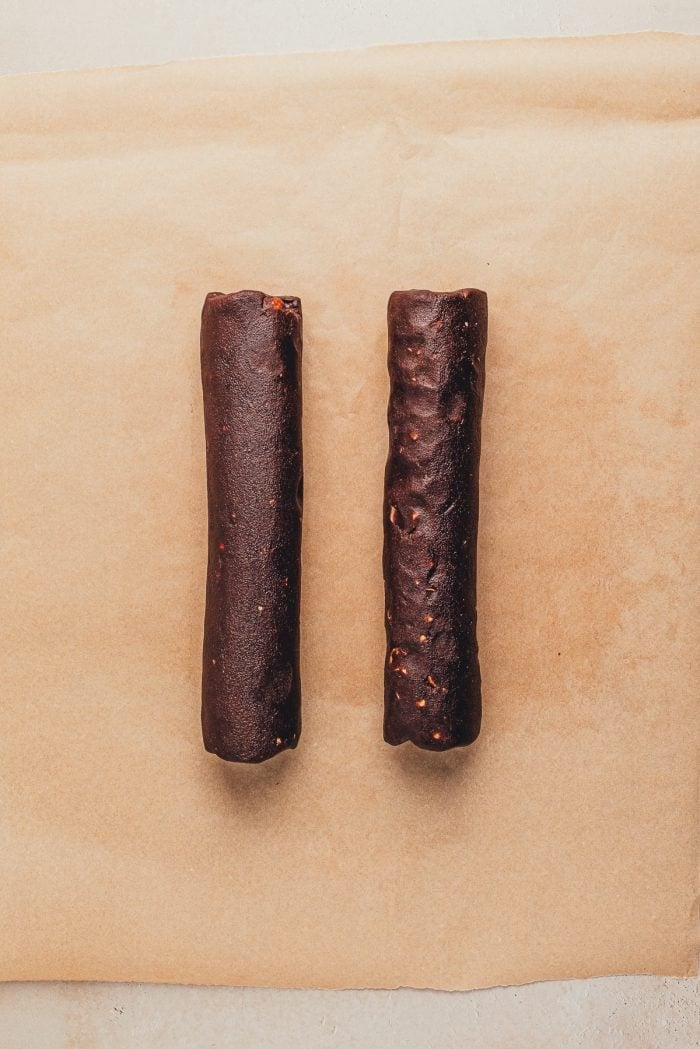 Two logs of chocolate slice and bake cookies unbaked.