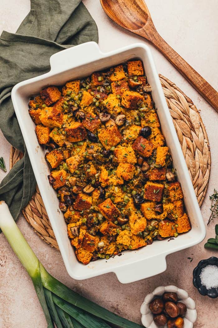 A white rectangle baking dish with baked stuffing.