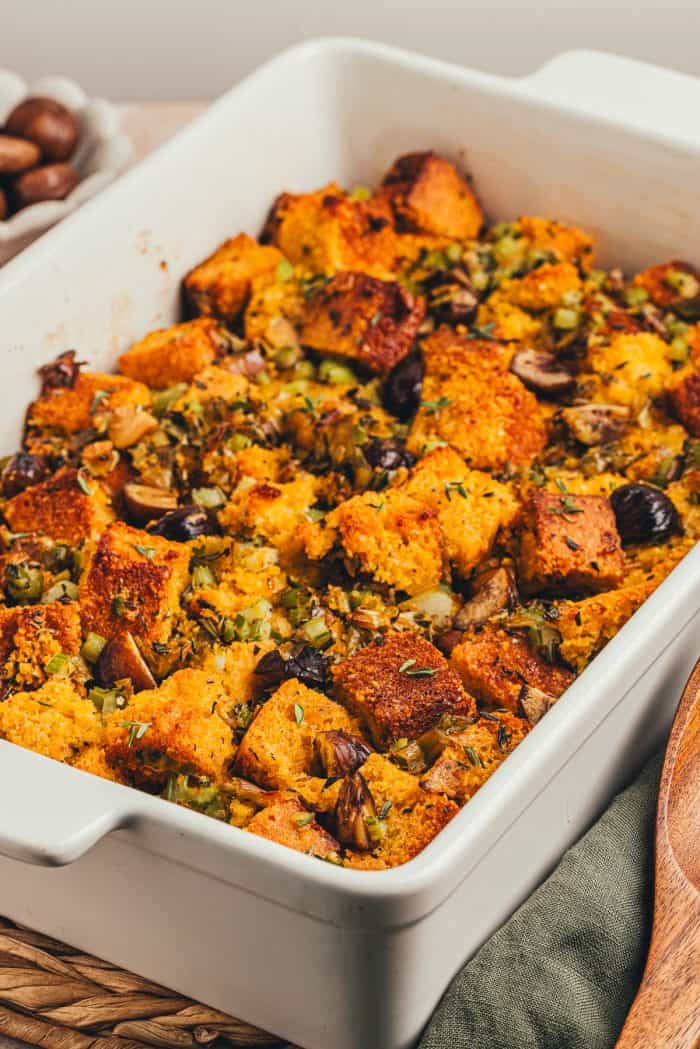 A white rectangle baking dish with baked stuffing.