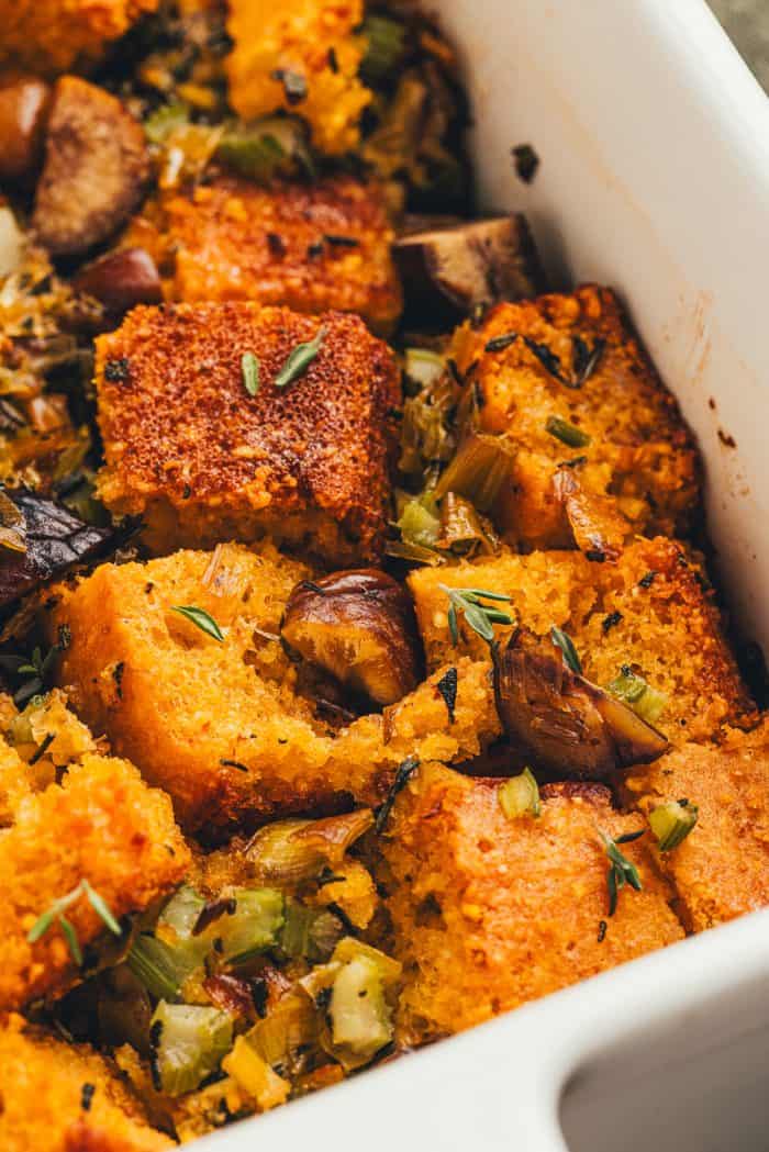 A white baking dish with homemade cornbread stuffing.